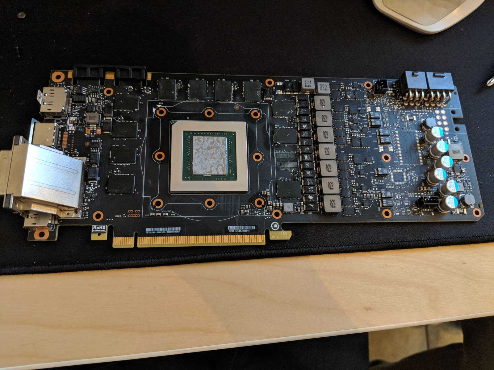 The bare GPU board cleaned and prepped with fresh thermal paste, ready for the water block