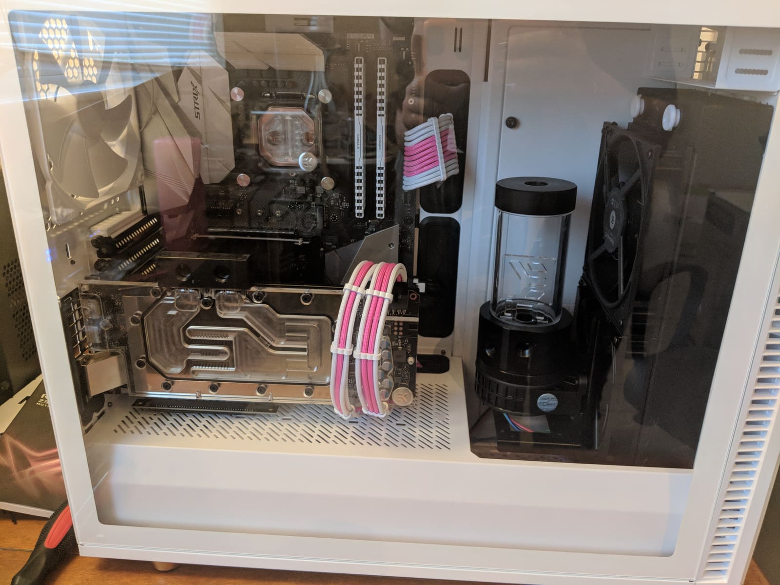 The reservoir, water-blocked GPU, and radiator mounted in the case before any tubing is run