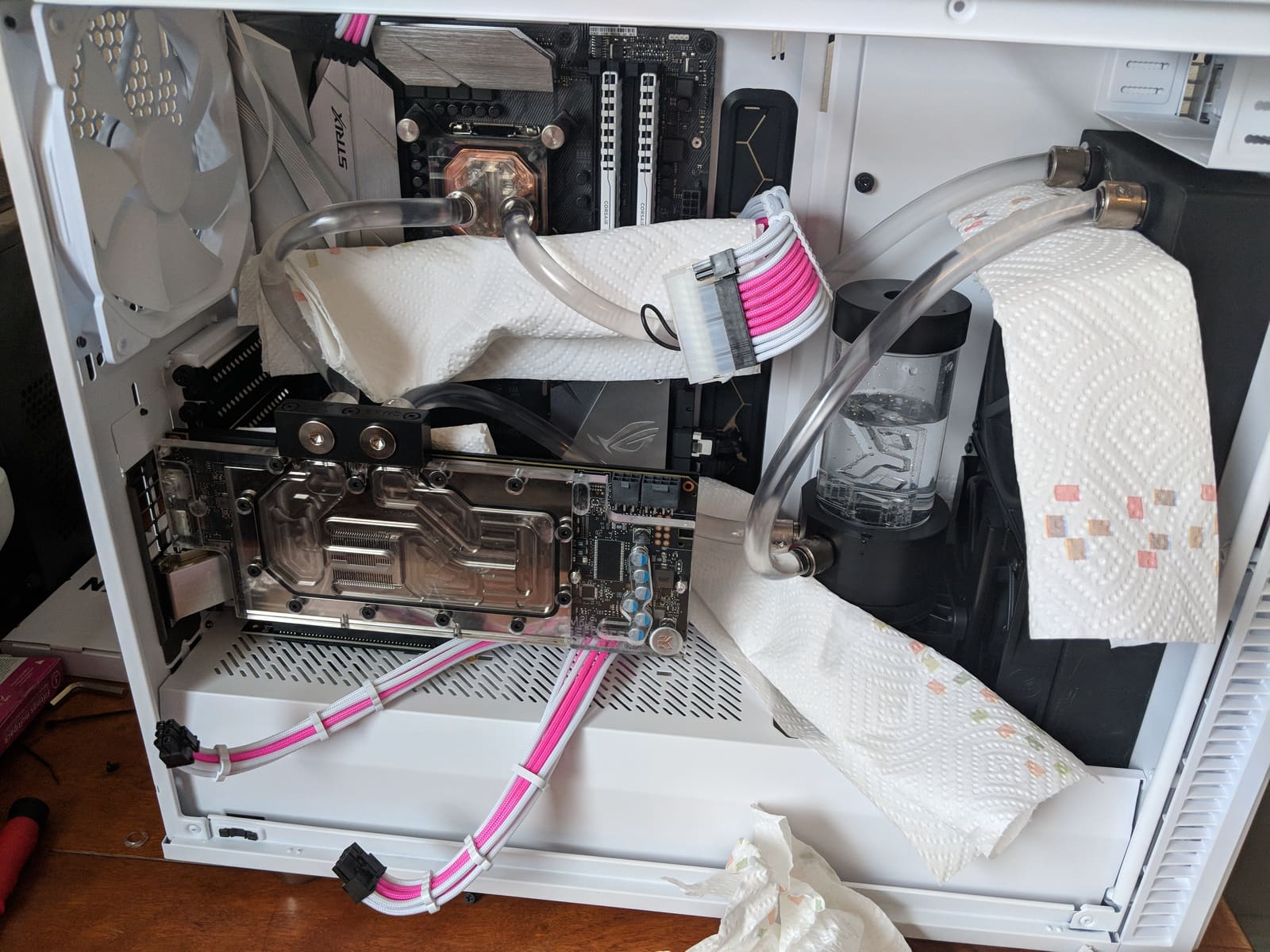 The loop filled for a leak test, with paper towels tucked under every fitting